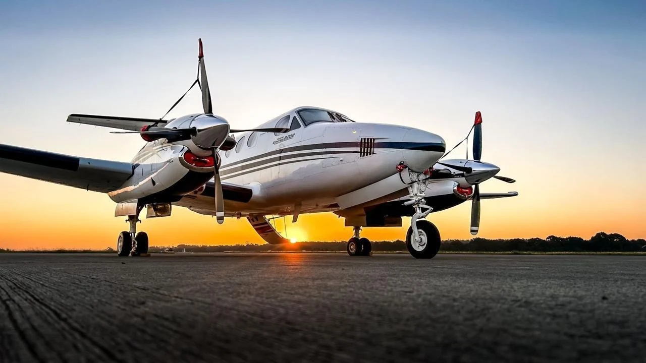 Twin-engine turboprop aircraft at sunset